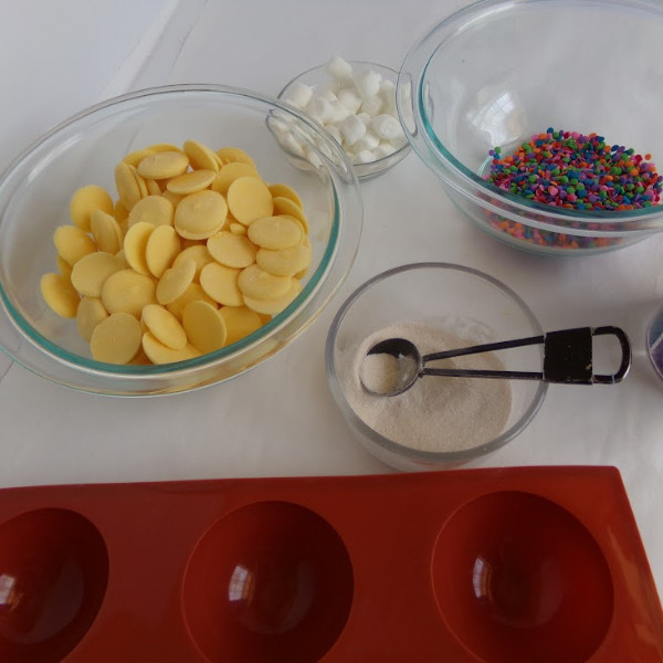 ingredients to make hot cocoa bombs with birthday cake flavoring